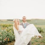 Groom carrying bride