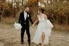 Wedding couple running and laughing together
